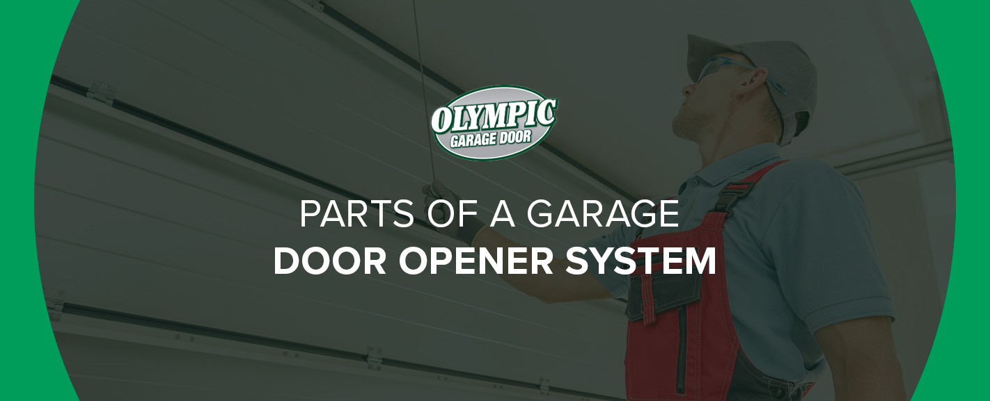 Workman imspecting the parts of a garage door opener system